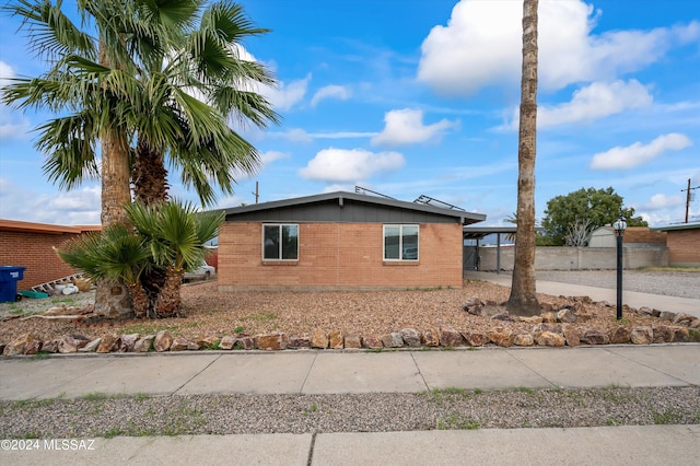 view of front facade with a carport