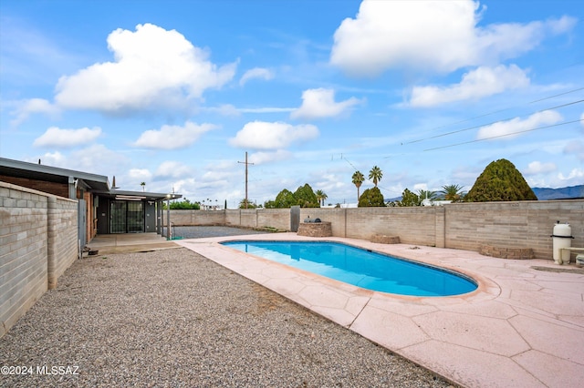 view of swimming pool featuring a patio area