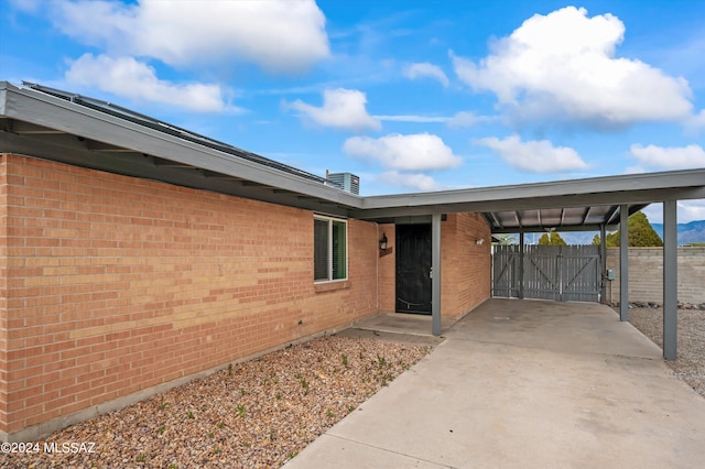 exterior space featuring a carport