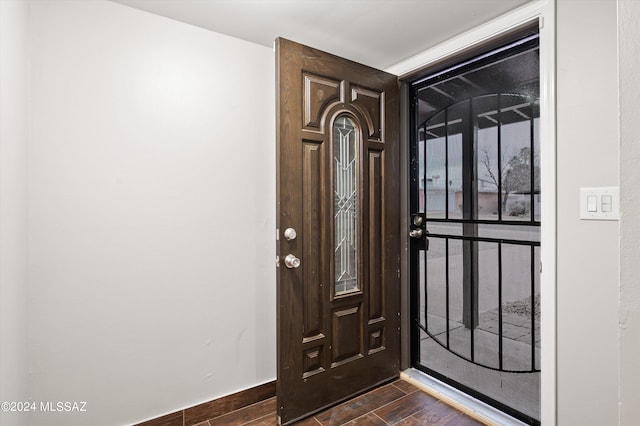 entryway with dark hardwood / wood-style floors