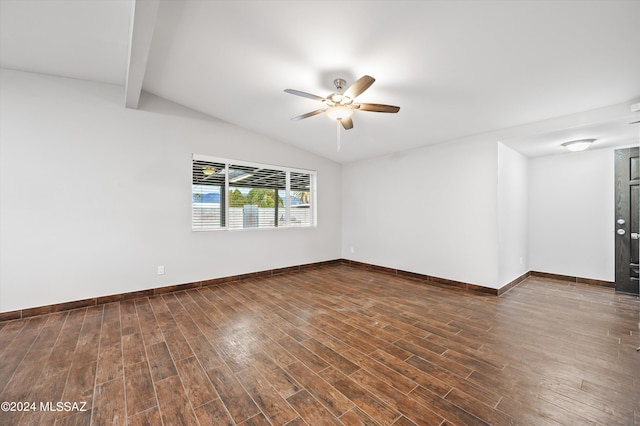 spare room featuring lofted ceiling with beams, ceiling fan, and dark wood-type flooring