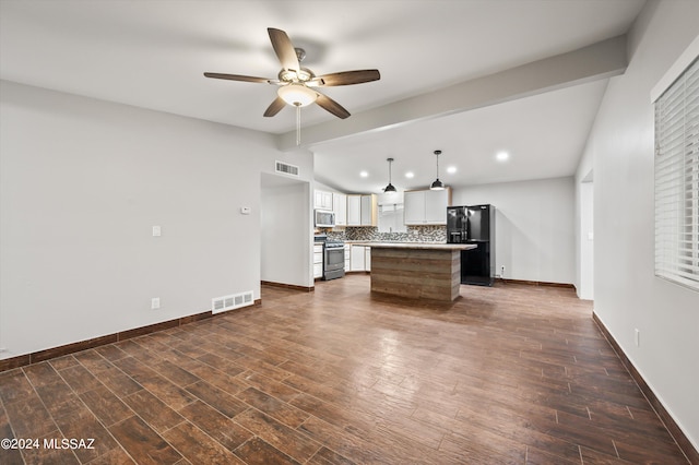 unfurnished living room with dark wood-type flooring, beam ceiling, and ceiling fan