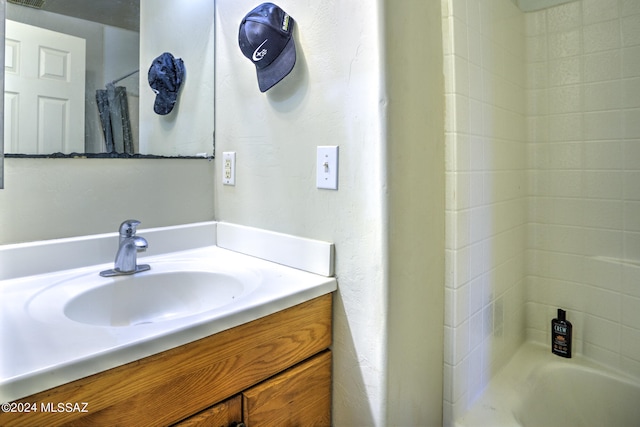 bathroom with shower / bath combination with curtain and vanity