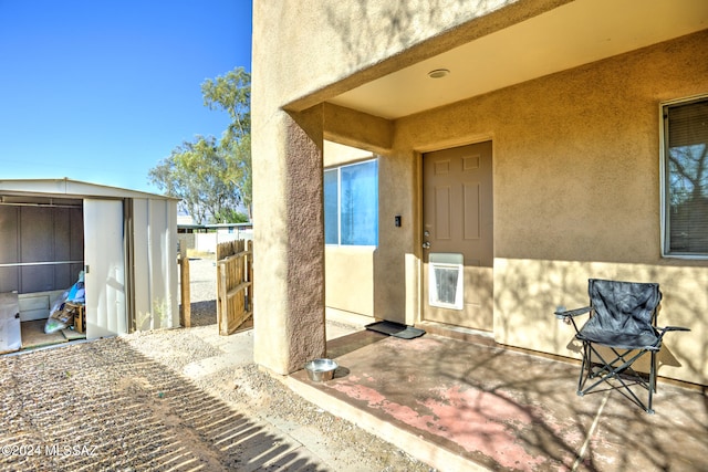 view of patio / terrace with a storage unit