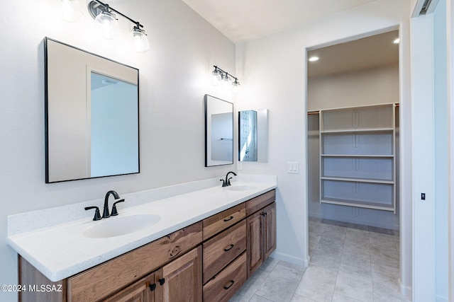 bathroom with tile patterned floors and vanity