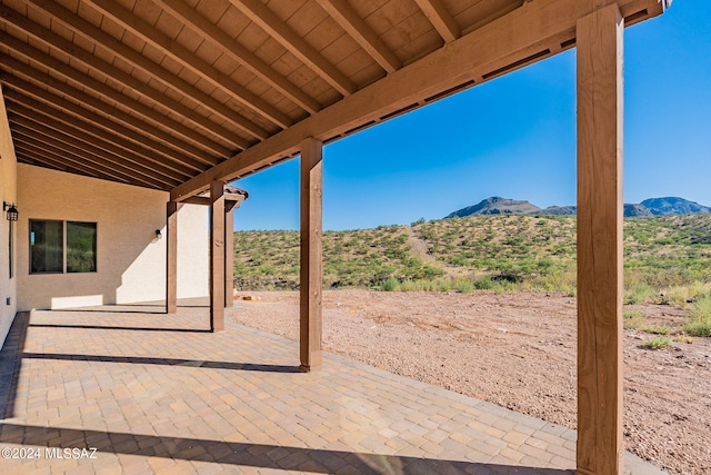 view of patio / terrace with a mountain view