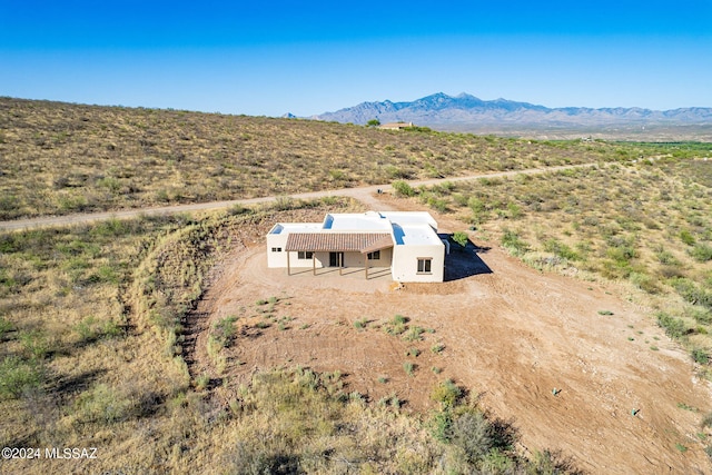 drone / aerial view featuring a mountain view