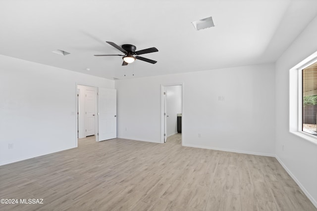 spare room featuring ceiling fan and light hardwood / wood-style floors