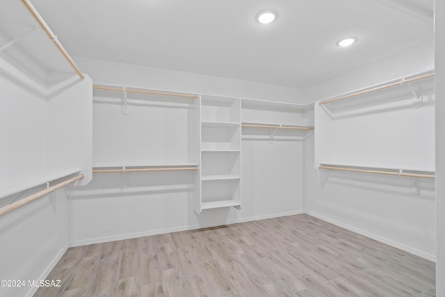 walk in closet featuring light hardwood / wood-style floors