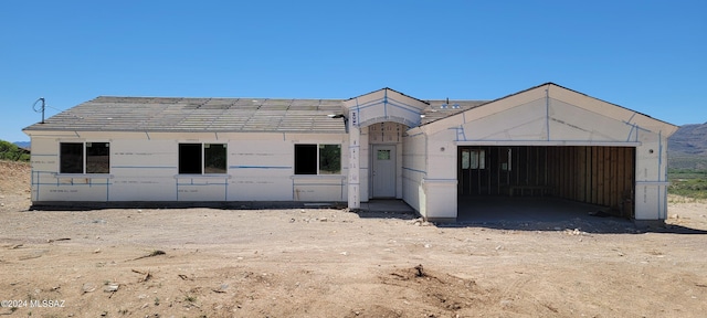 unfinished property featuring a garage