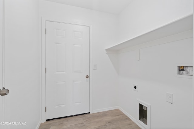laundry area with hookup for an electric dryer, hookup for a washing machine, and light wood-type flooring