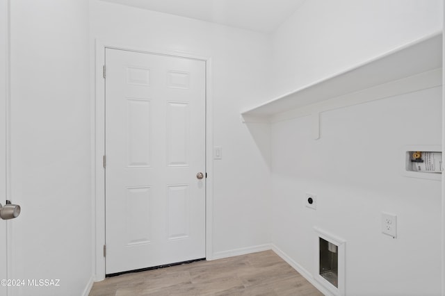 washroom featuring light hardwood / wood-style flooring, washer hookup, and hookup for an electric dryer