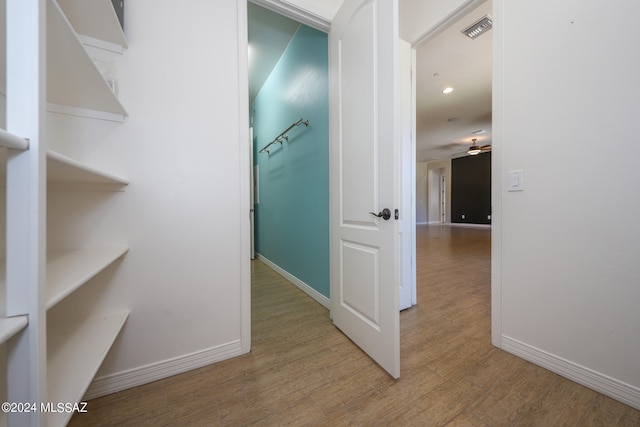 hallway with wood-type flooring