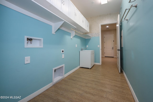 laundry room featuring light hardwood / wood-style floors, sink, and hookup for an electric dryer