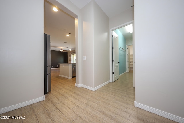 hall with light hardwood / wood-style floors