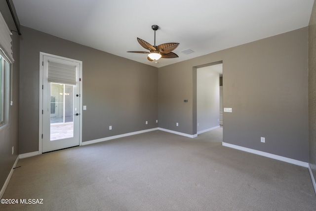 empty room with carpet and ceiling fan