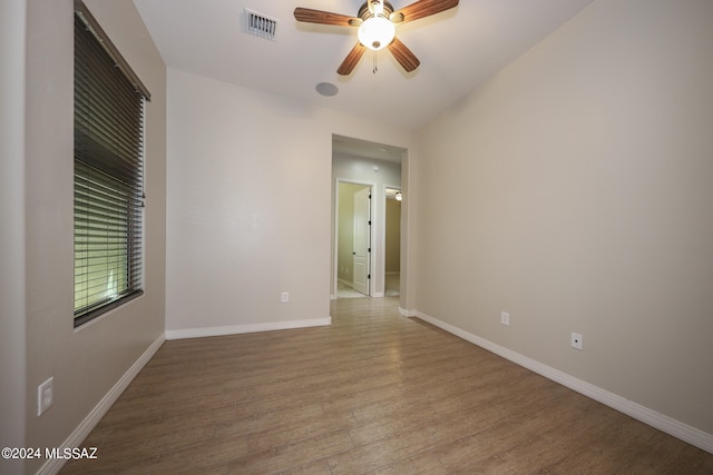 unfurnished room featuring wood-type flooring and ceiling fan