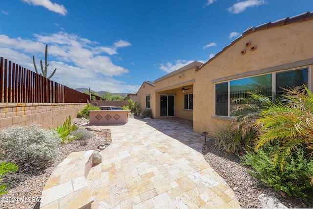 view of patio with ceiling fan