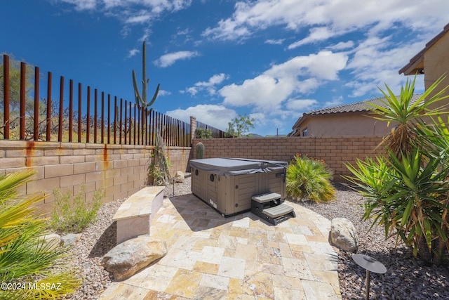 view of patio with a hot tub