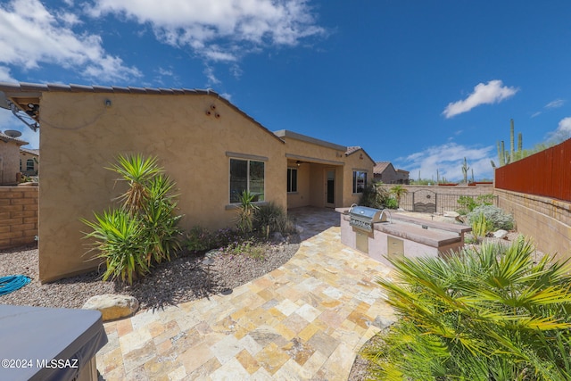 back of house with a patio