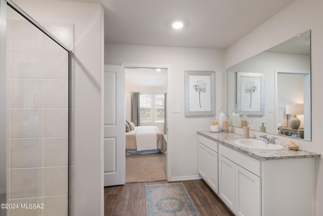 bathroom with vanity and hardwood / wood-style flooring