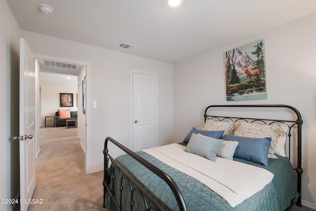 bedroom featuring light colored carpet