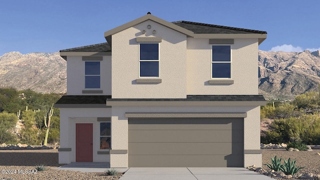 view of front facade with a garage and a mountain view