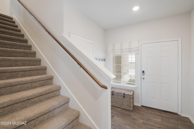 foyer with dark hardwood / wood-style floors