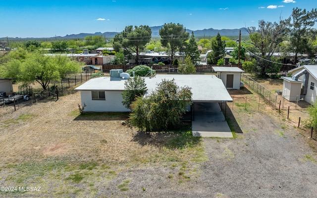 birds eye view of property with a mountain view