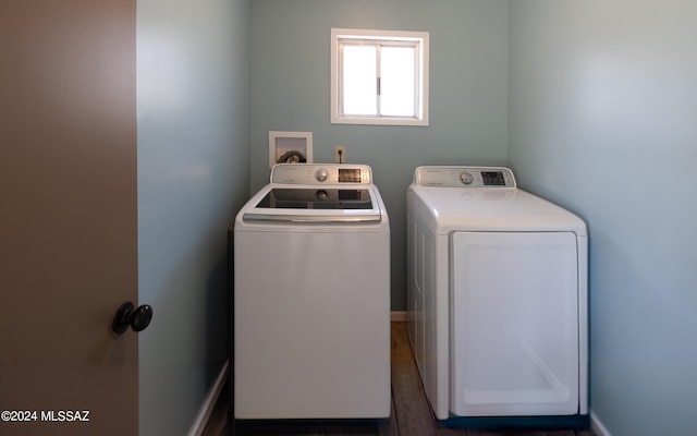 laundry room featuring hookup for a washing machine, dark hardwood / wood-style floors, and washer and dryer