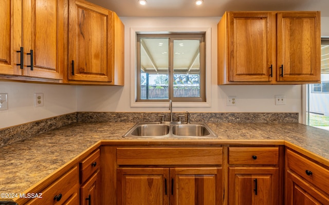 kitchen featuring plenty of natural light and sink