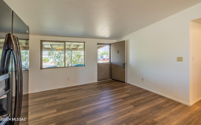 empty room featuring dark hardwood / wood-style flooring