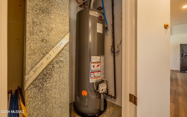 utility room featuring gas water heater