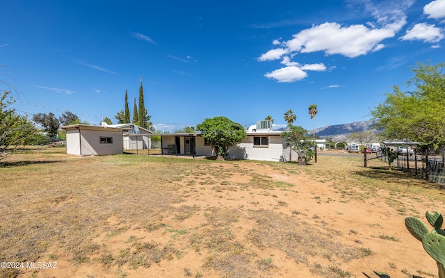 view of yard with a mountain view and an outdoor structure