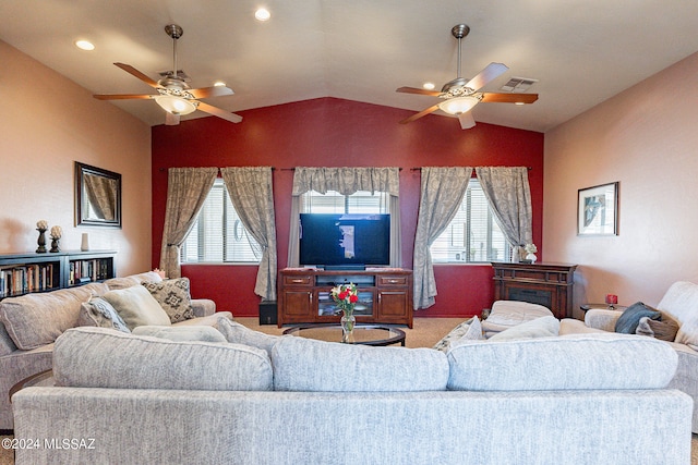 carpeted living room featuring ceiling fan and lofted ceiling