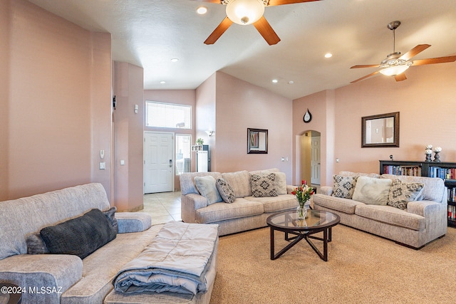 living room with high vaulted ceiling, ceiling fan, and light tile flooring