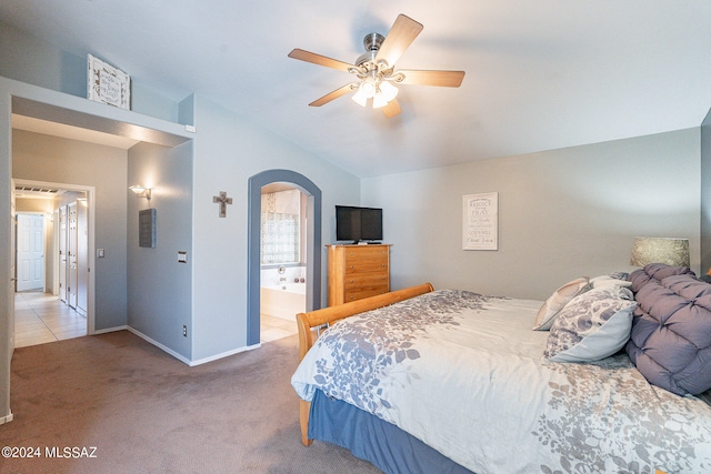 bedroom featuring ceiling fan, carpet flooring, and ensuite bath