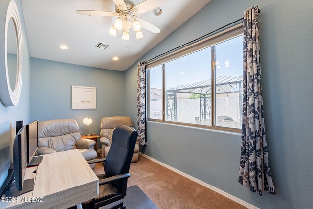 carpeted office featuring vaulted ceiling and ceiling fan