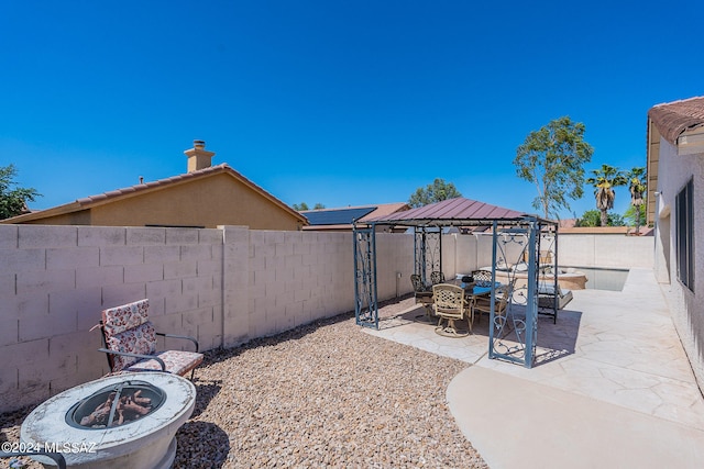 view of yard with a patio area, a fire pit, and a gazebo