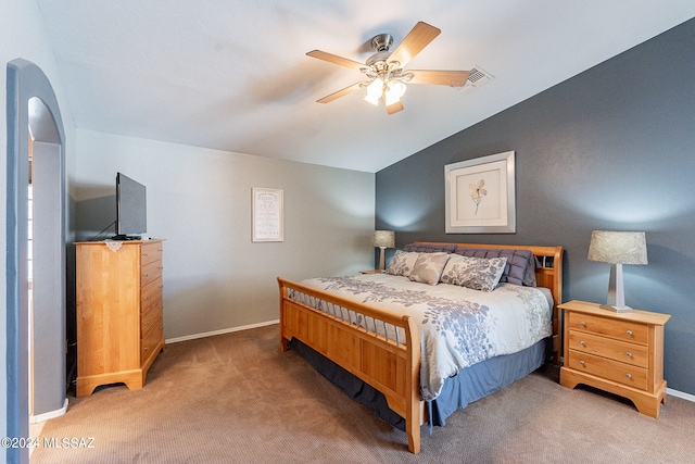 bedroom with vaulted ceiling, ceiling fan, and carpet