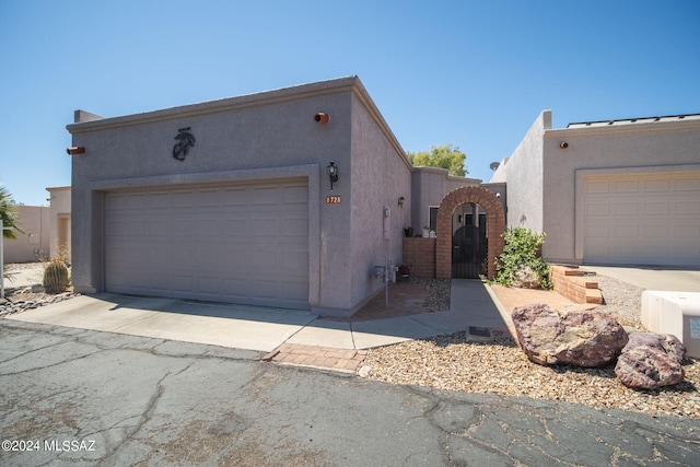 southwest-style home with a garage