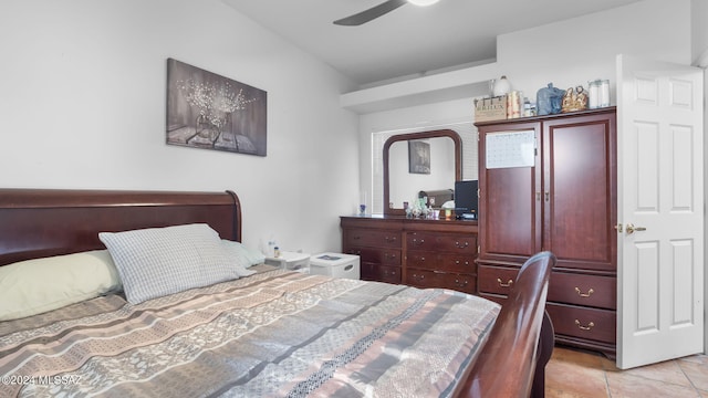 tiled bedroom with ceiling fan