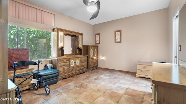 office space featuring ceiling fan and light tile flooring