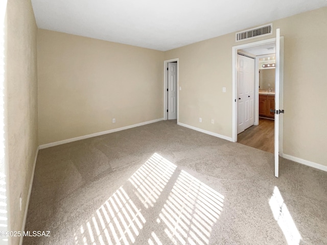 unfurnished bedroom with carpet floors