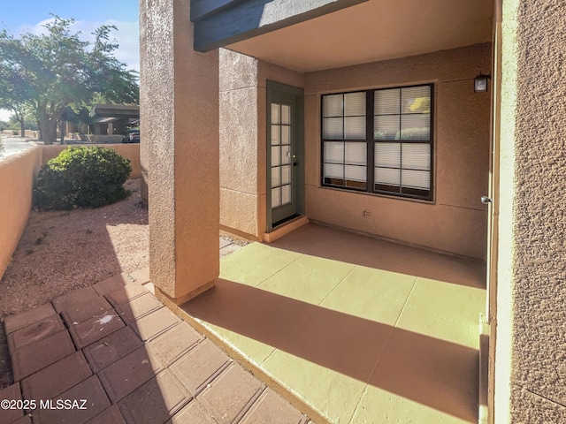 doorway to property with a patio area