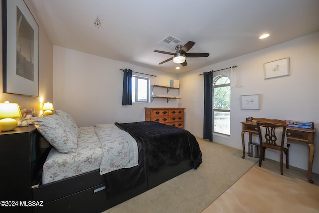 bedroom with light colored carpet and ceiling fan