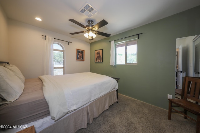 carpeted bedroom with ceiling fan