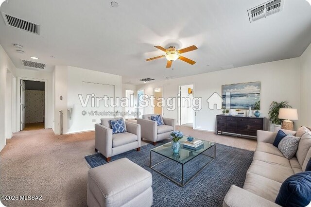 carpeted living room featuring ceiling fan