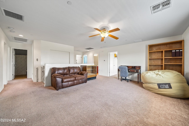 carpeted living room featuring ceiling fan