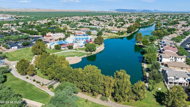 drone / aerial view with a water view and a residential view